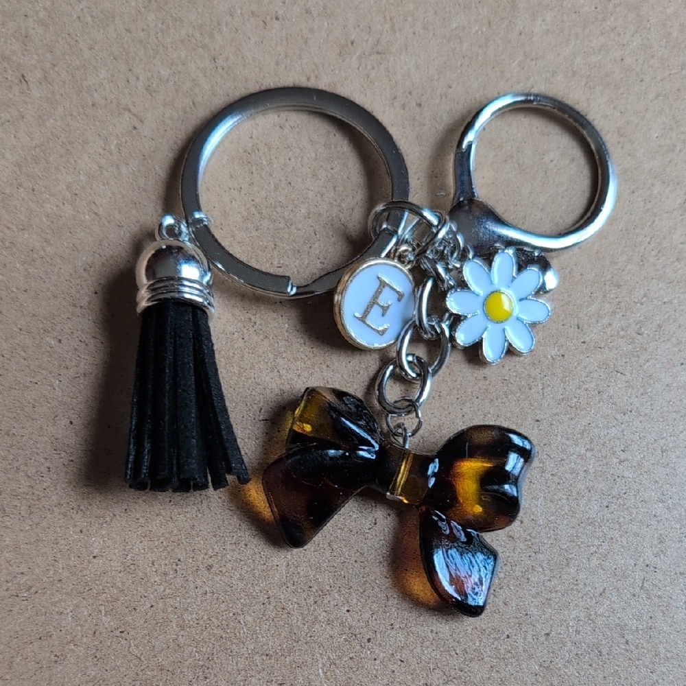 Silver Brown and Black Bow Initial keychain with tassel and daisy charm : E